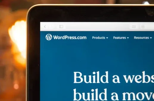 The WordPress.com homepage on a laptop screen